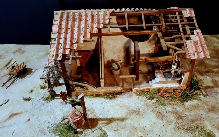 Ricostruzione di come poteva presentarsi il rustico di cui il pozzo faceva parte (Plastico di Mauro Cutrona)
